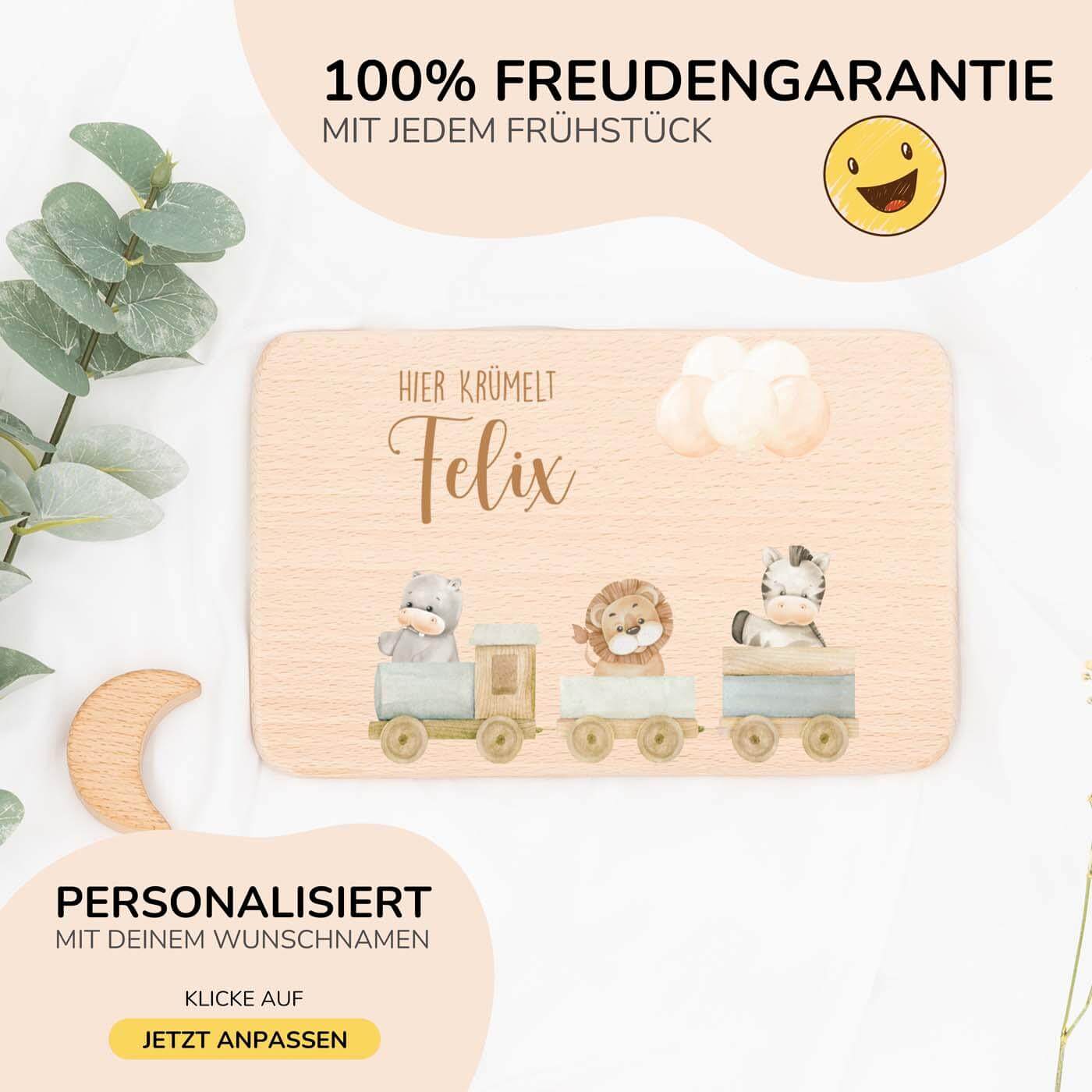 nahaufnahme des frühstücksbrettchens mit tier-eisenbahn motiv