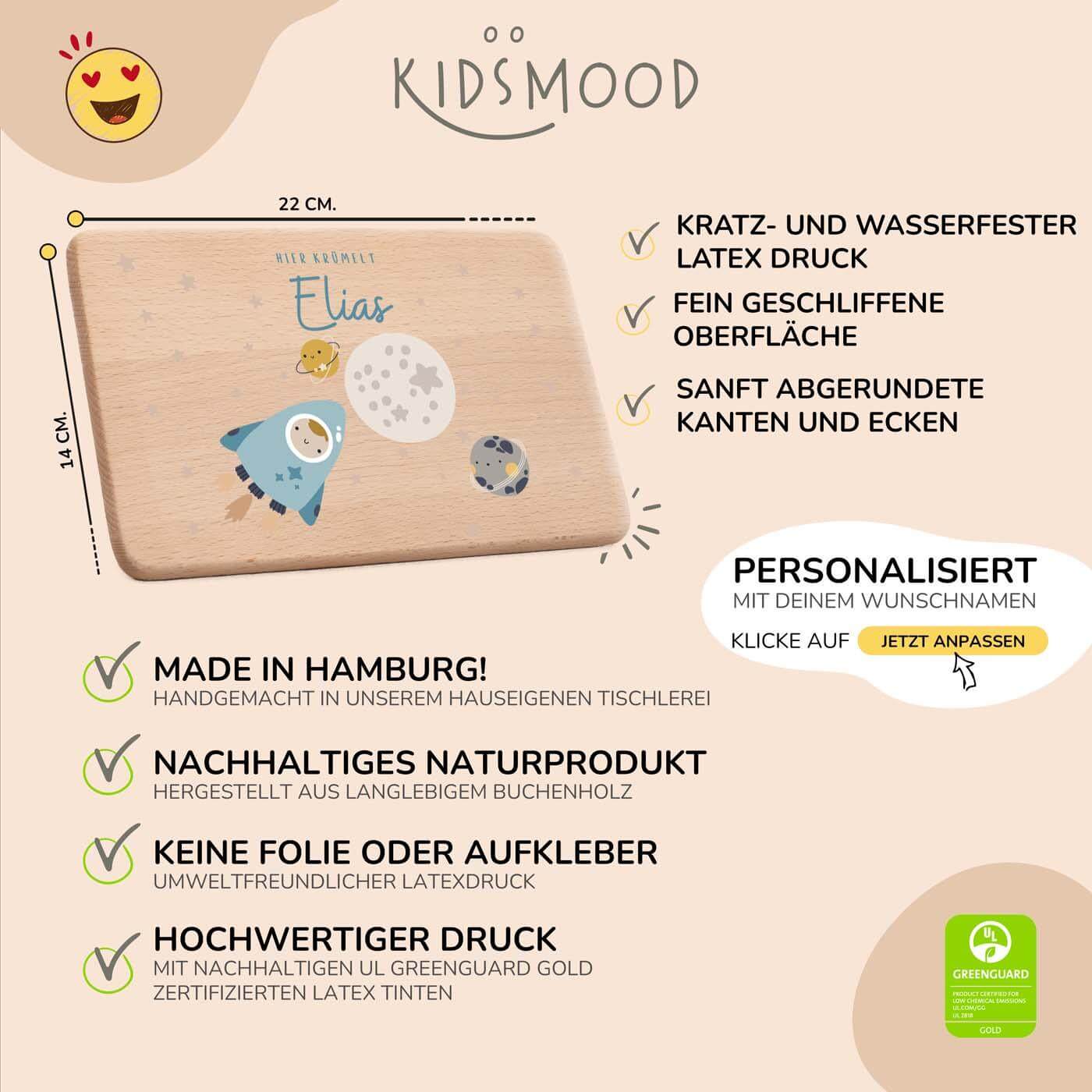 detailansicht der gravur auf dem frühstücksbrettchen mit weltall