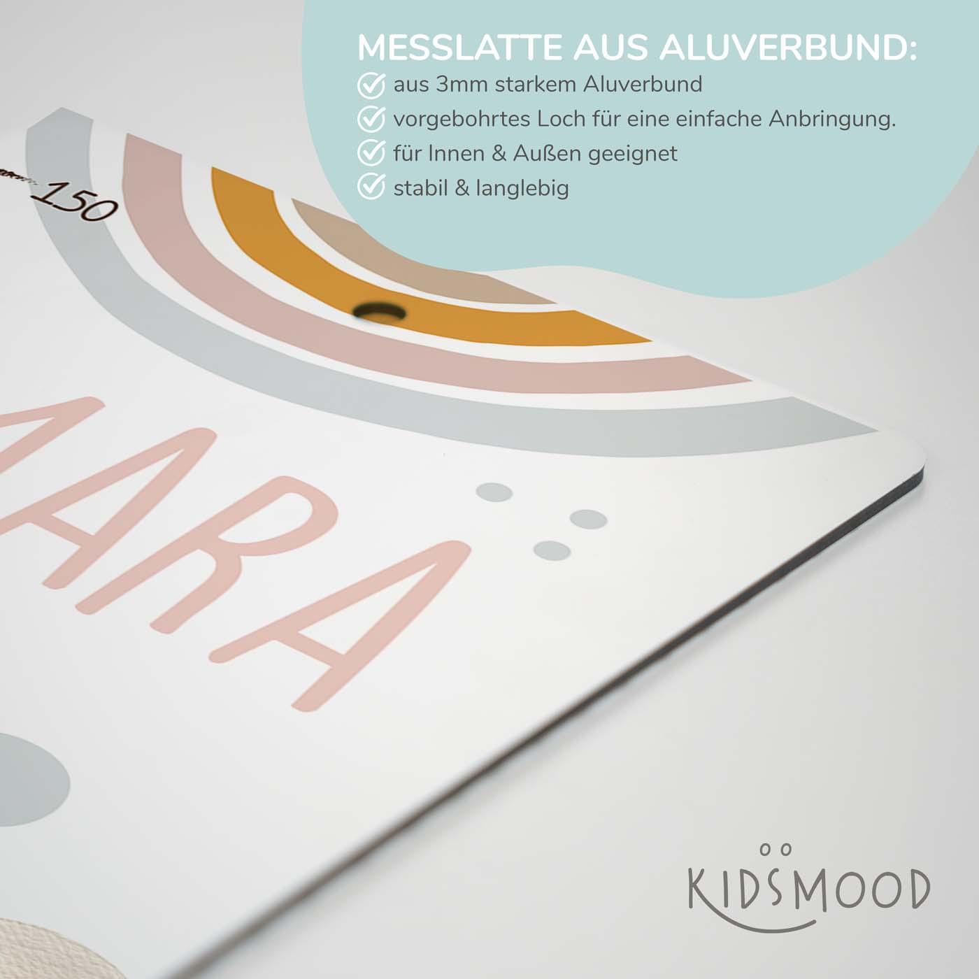 handcrafted growth chart with rainbow and clouds motif