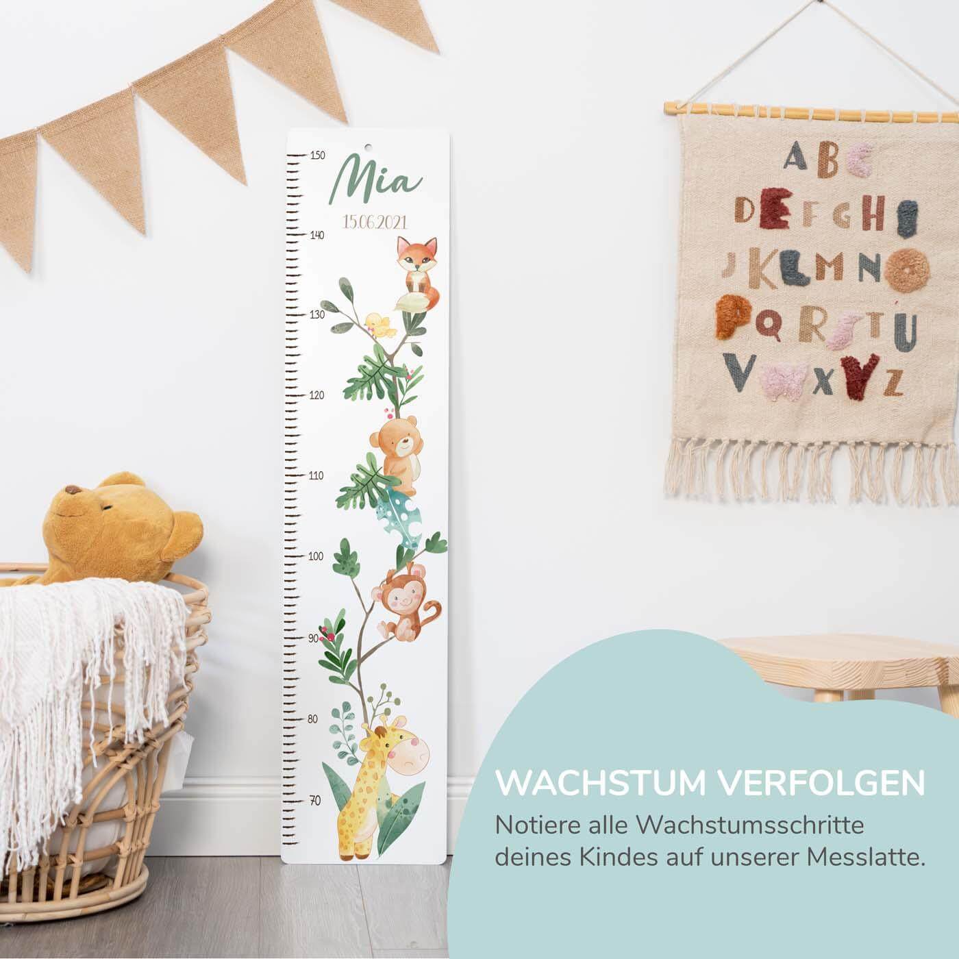 close-up of height chart with bear and jungle motif