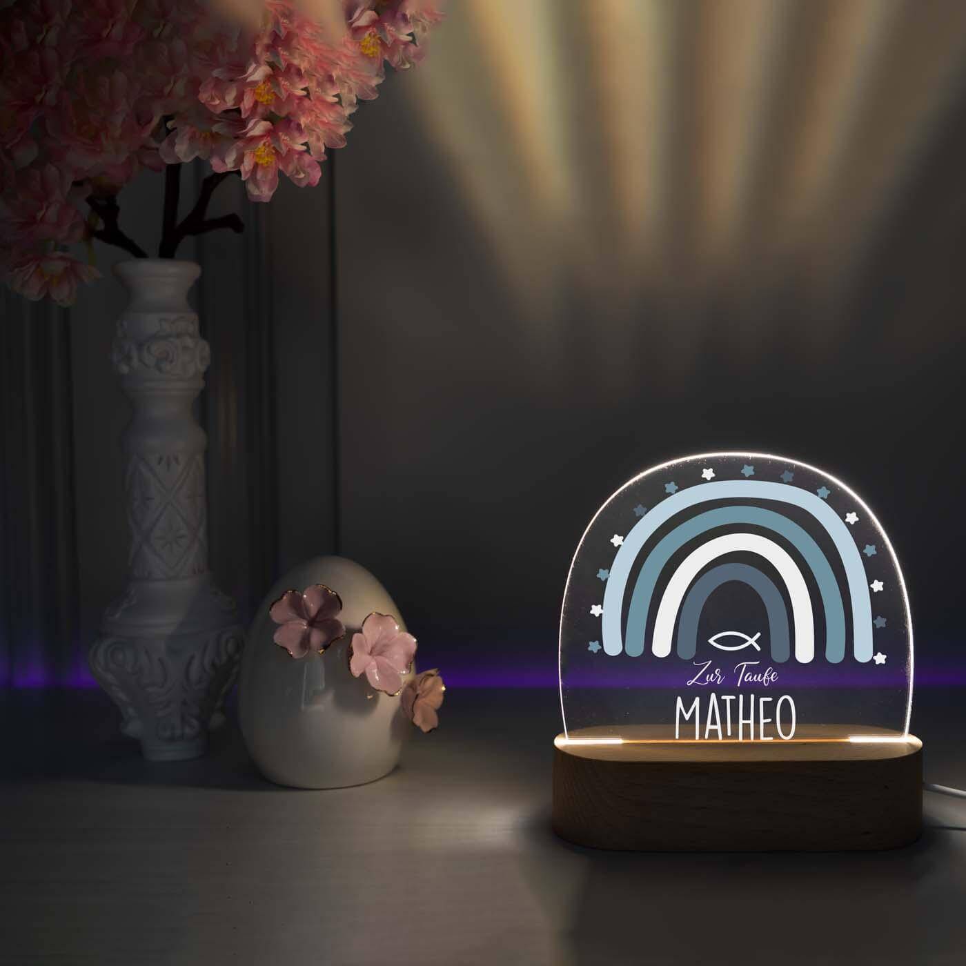 close-up of night lamp with regenbogen and tauffisch motif