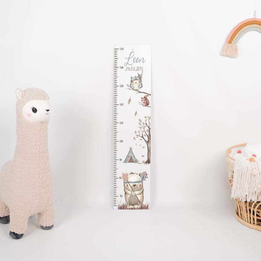 close-up of growth chart with woodland bär motif